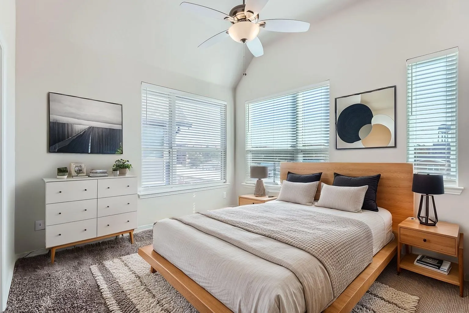 A photo of a bedroom with natural light